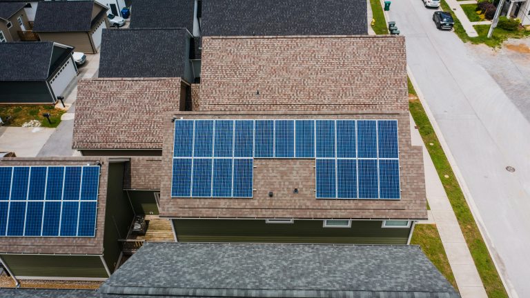 aerial view of solar panels on tiled roofs