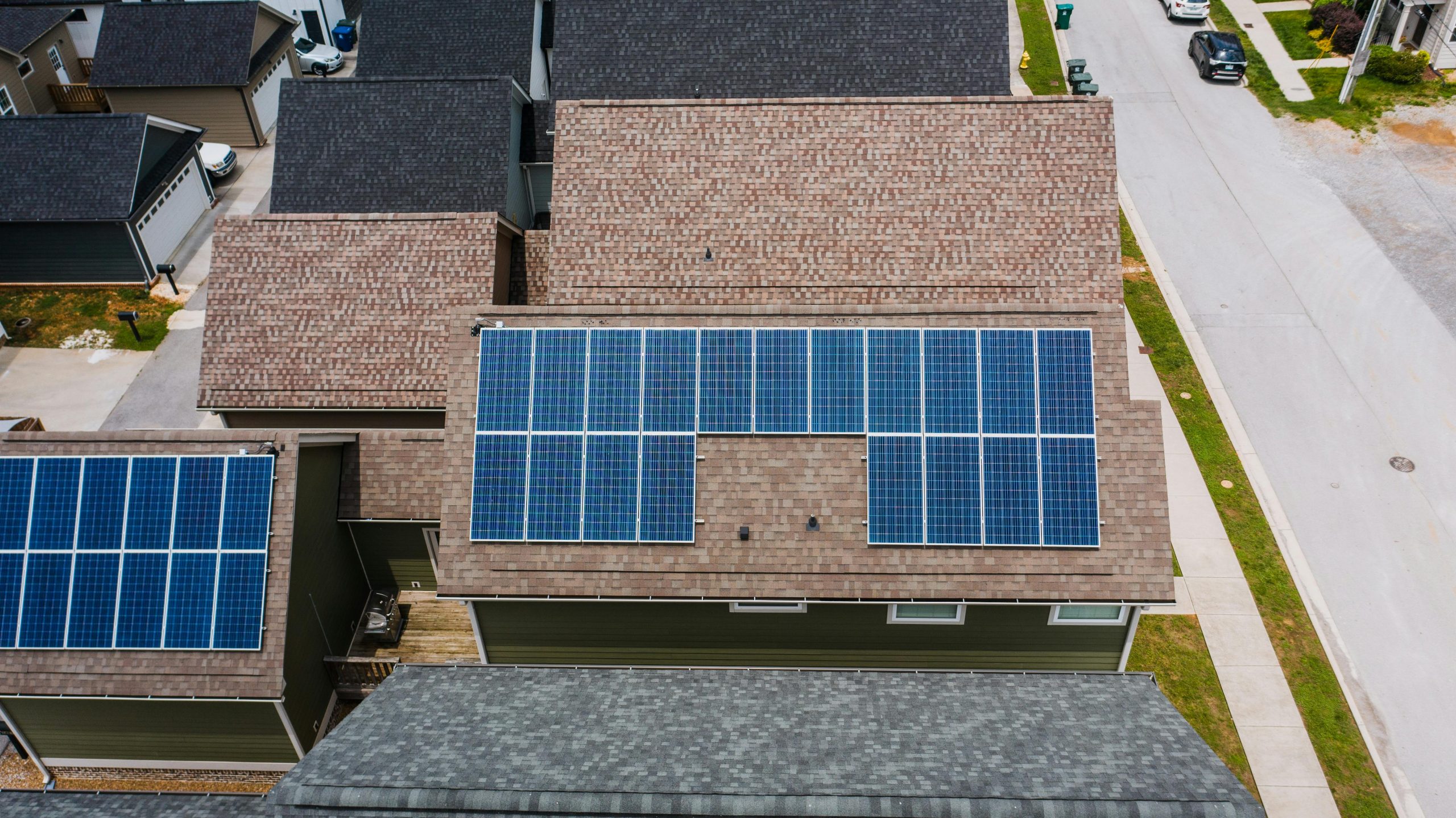 aerial view of solar panels on tiled roofs